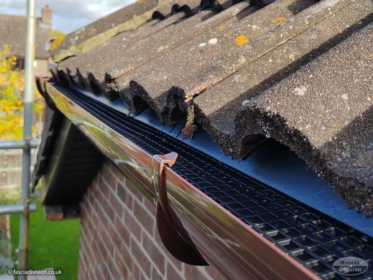 Newly cleared uPVC guttering with eaves tray and gutter guard