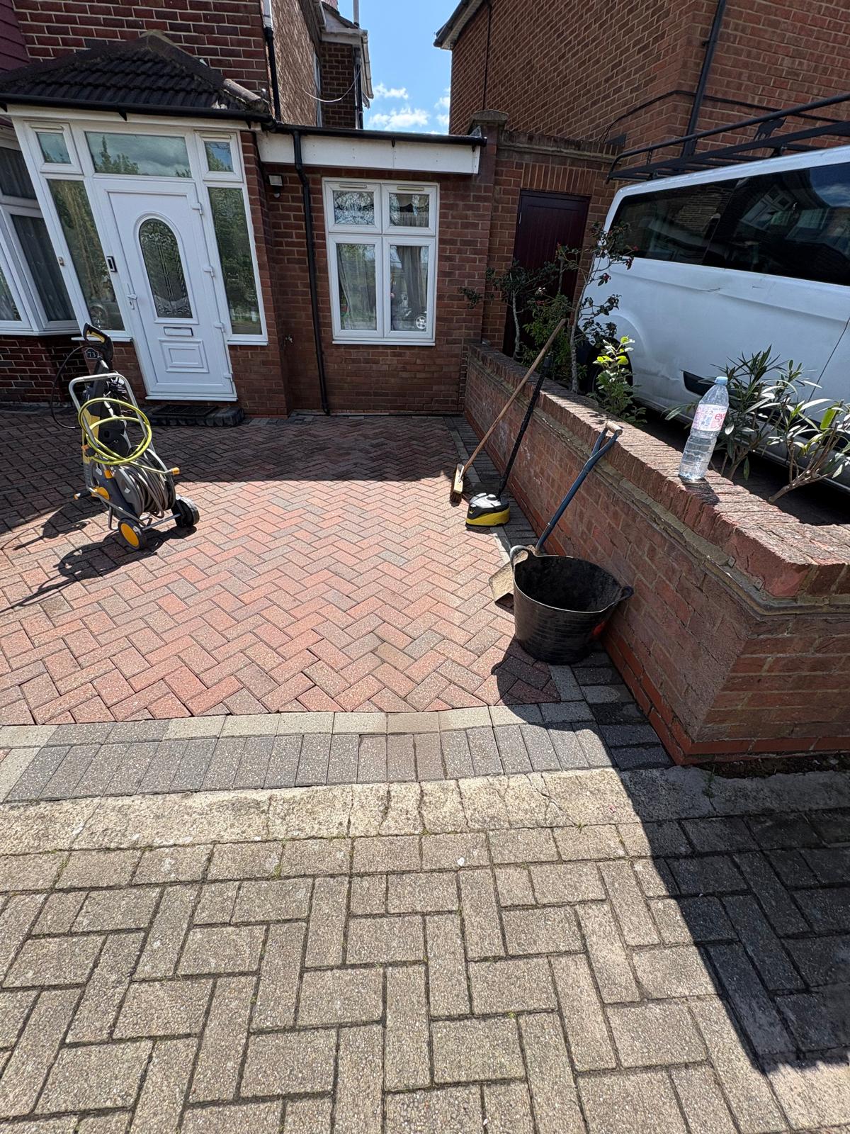 Aqua Care owner pressure washing a driveway in Stanmore